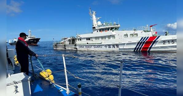 Chinese ships chase Philippine vessels as US renews warning it will defend its treaty ally