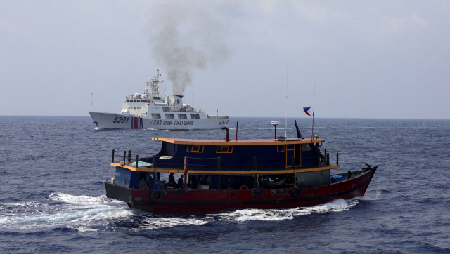 Philippines defies China, aims to continue military presence in South China Sea Philippines defies China, aims to continue military presence in South China Sea